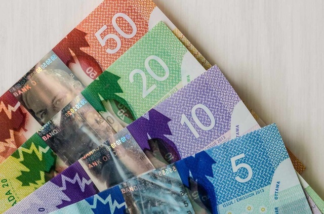 Deprecierea dolarului canadian sub presiunea instabilității din Orientul Mijlociu și a cererii pentru dolarul american